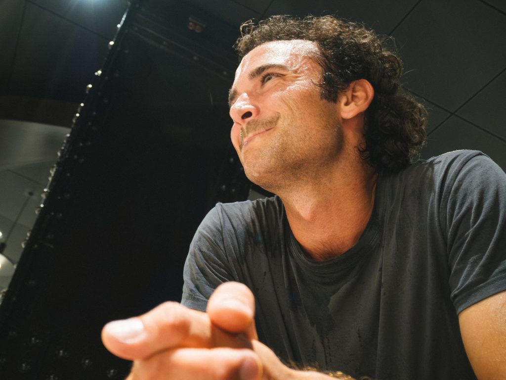 A player smiling during a conversation after the squash matches.